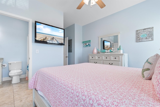 tiled bedroom with connected bathroom and ceiling fan