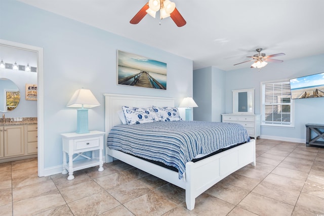 tiled bedroom featuring ensuite bathroom and ceiling fan