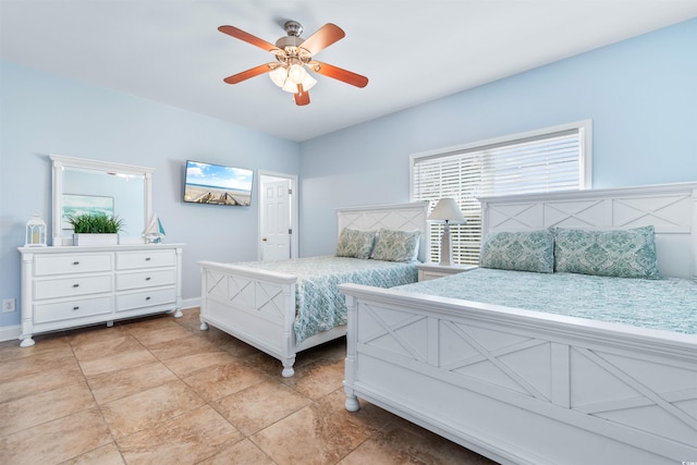 tiled bedroom with ceiling fan