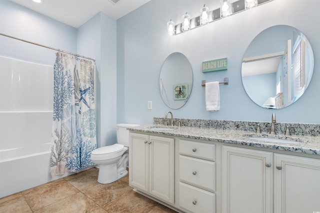 full bathroom with vanity, shower / tub combo, toilet, and tile patterned floors