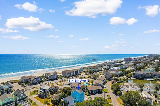 aerial view with a water view and a view of the beach