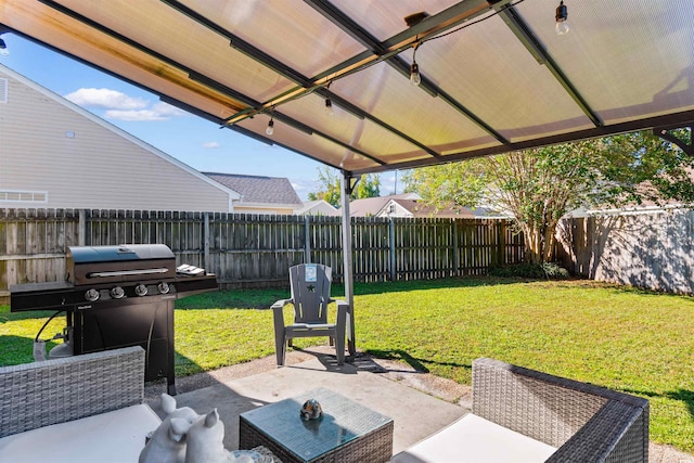 view of patio with outdoor lounge area and a grill