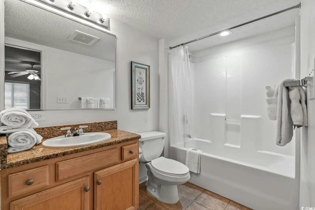 full bathroom with shower / bath combination with curtain, ceiling fan, a textured ceiling, toilet, and vanity