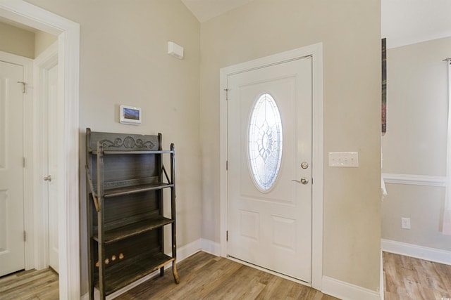 entryway with light hardwood / wood-style floors