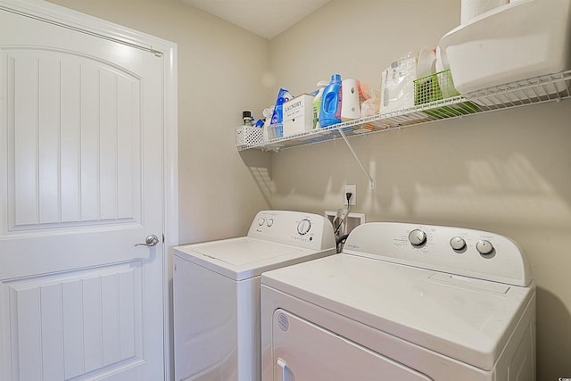 washroom with washing machine and dryer