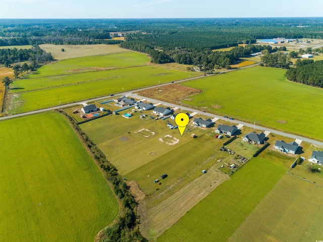 birds eye view of property with a rural view