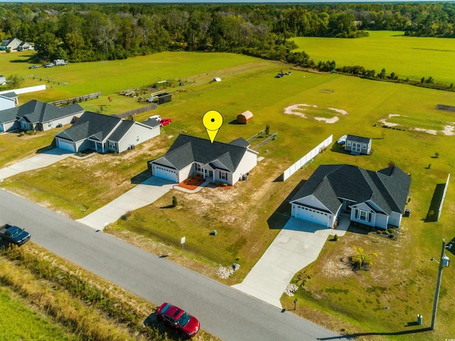 birds eye view of property featuring a rural view