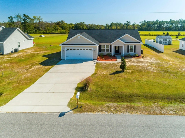 ranch-style home with central AC unit, a garage, and a front lawn