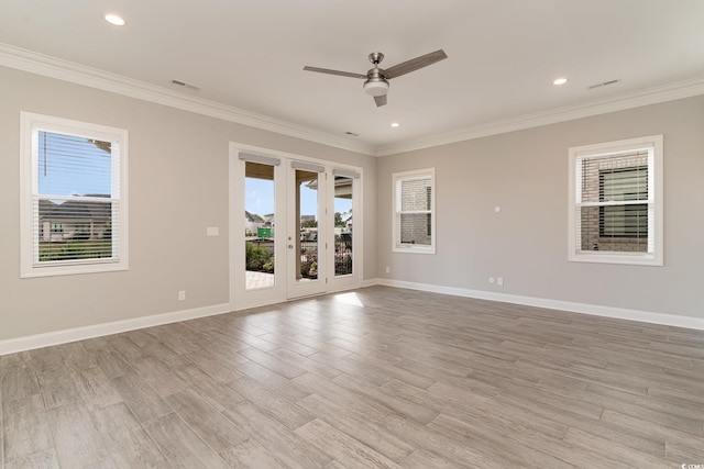 unfurnished room with crown molding, light hardwood / wood-style flooring, french doors, and ceiling fan