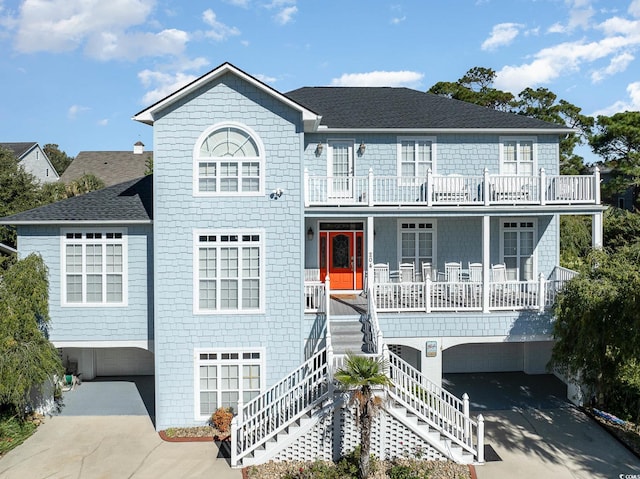 view of front of home featuring covered porch and a garage