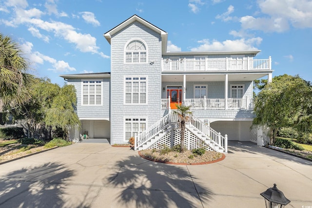 view of front facade with a porch and a garage