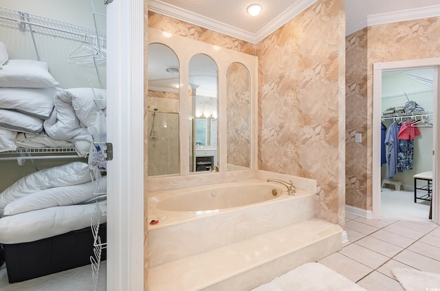 bathroom featuring separate shower and tub, a textured ceiling, ornamental molding, and tile patterned floors