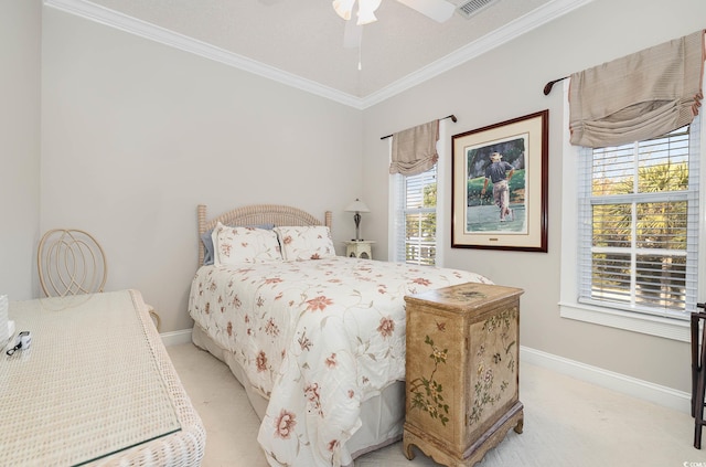 bedroom with crown molding, light carpet, and ceiling fan