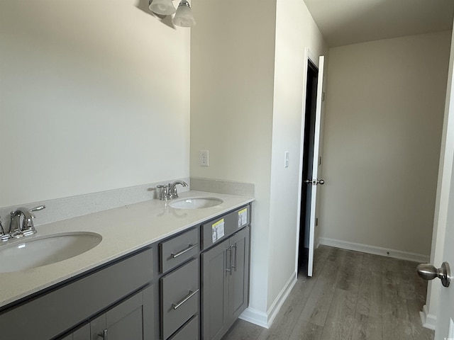 bathroom with vanity and hardwood / wood-style floors