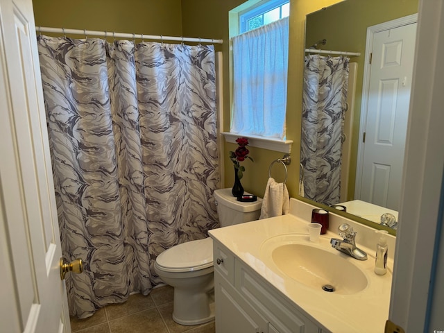 bathroom featuring vanity, toilet, tile patterned flooring, and a shower with shower curtain