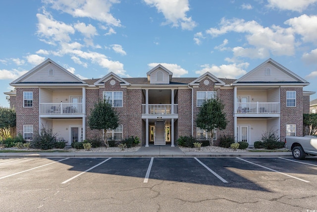 view of property with uncovered parking