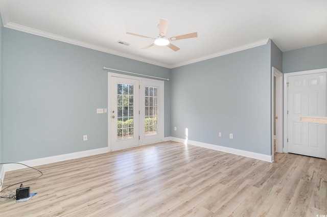 spare room featuring crown molding, light wood-type flooring, and ceiling fan