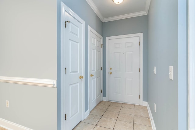 doorway with baseboards, ornamental molding, and light tile patterned floors