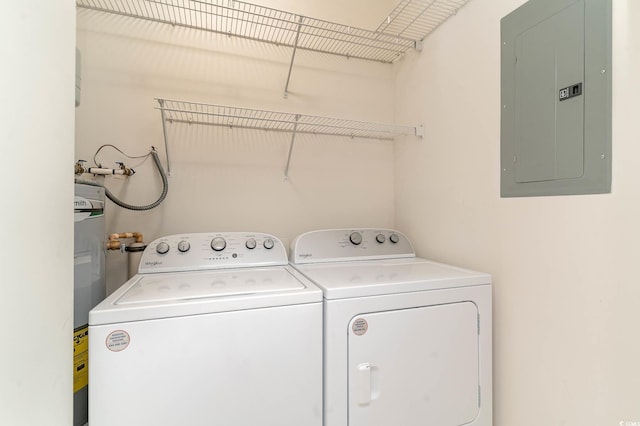 laundry room with washer and dryer, laundry area, and electric panel