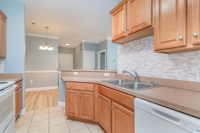 kitchen with ornamental molding, sink, an inviting chandelier, white appliances, and tasteful backsplash