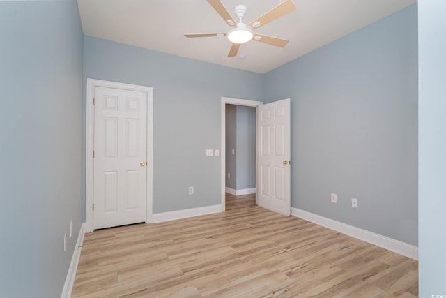 unfurnished bedroom featuring light hardwood / wood-style floors and ceiling fan