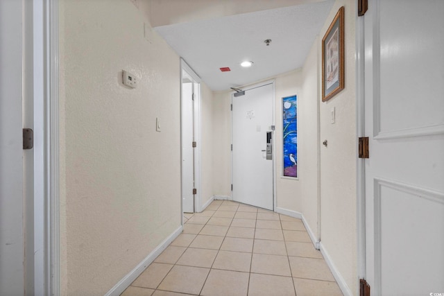 hallway with light tile patterned floors