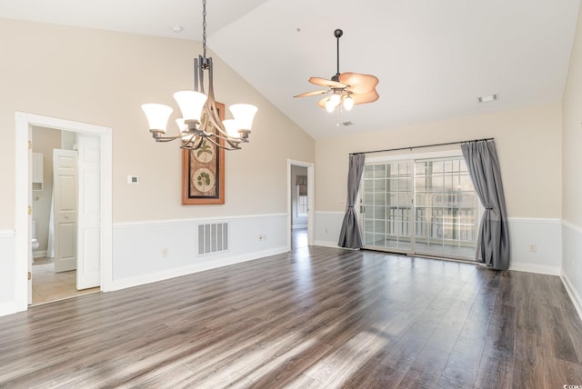 empty room featuring ceiling fan with notable chandelier, dark hardwood / wood-style flooring, and high vaulted ceiling