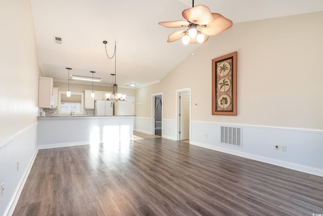 unfurnished living room with dark hardwood / wood-style floors, ceiling fan, sink, and high vaulted ceiling