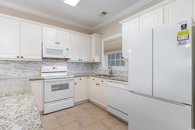 kitchen with light stone countertops, sink, light tile patterned flooring, white appliances, and white cabinets