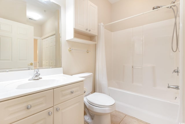 full bathroom with shower / bath combo with shower curtain, tile patterned flooring, vanity, and toilet