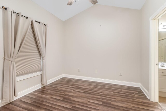 empty room featuring ceiling fan, dark hardwood / wood-style flooring, and lofted ceiling