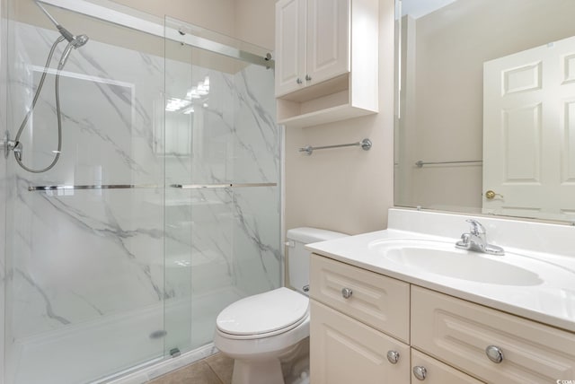 bathroom with tile patterned flooring, vanity, toilet, and an enclosed shower