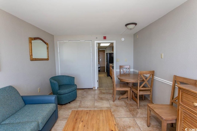 dining room featuring light tile patterned flooring