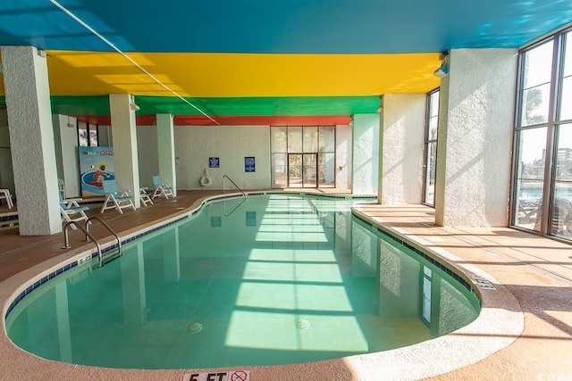 view of pool with a jacuzzi