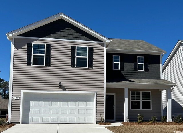 front of property featuring a garage