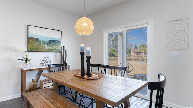 dining space featuring dark hardwood / wood-style floors