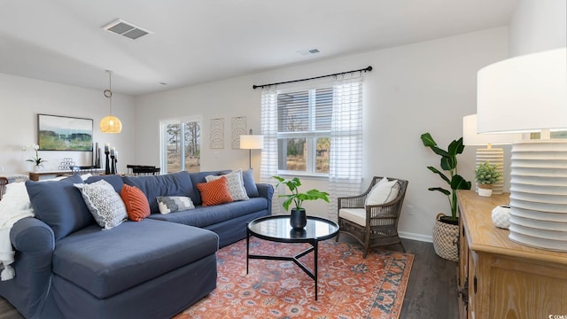 living room with dark hardwood / wood-style flooring