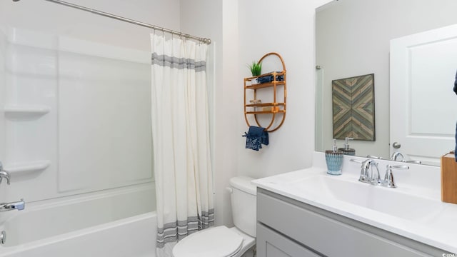 full bathroom featuring toilet, shower / bath combo with shower curtain, and vanity