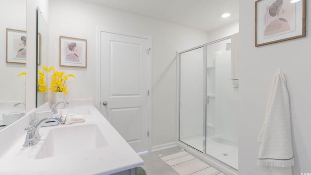 bathroom featuring vanity and an enclosed shower