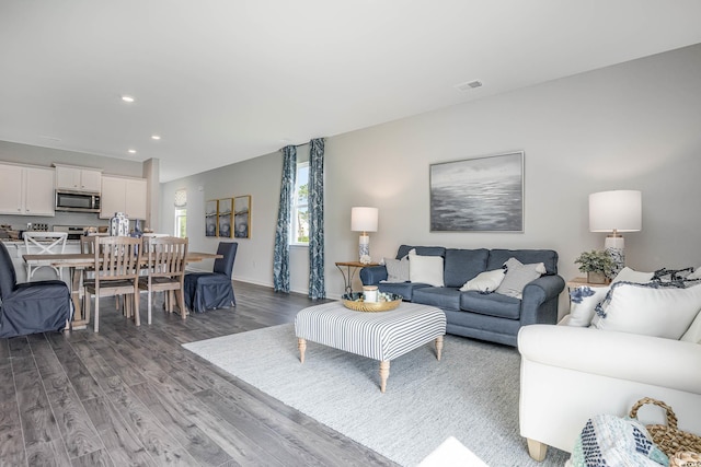 living room with dark wood-type flooring