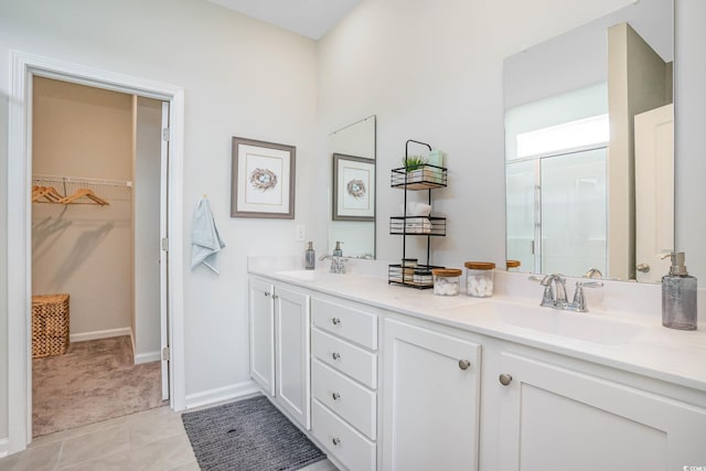 bathroom with vanity, tile patterned flooring, and walk in shower