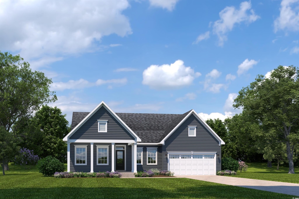 view of front of property with a garage and a front lawn