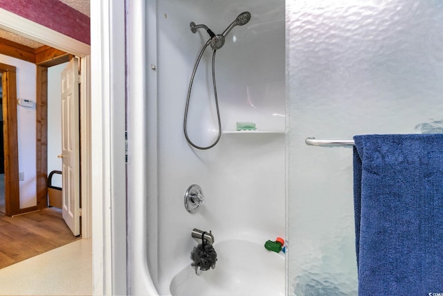 full bath with shower / bathtub combination and wood finished floors