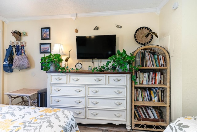 bedroom with ornamental molding and wood-type flooring