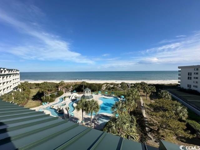 aerial view with a water view and a view of the beach