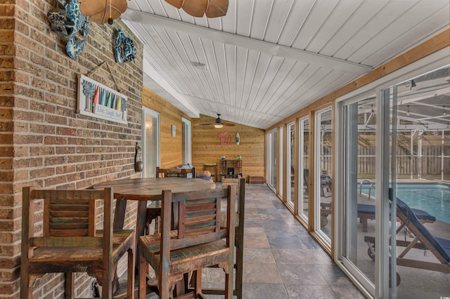 view of patio with a fenced in pool and ceiling fan