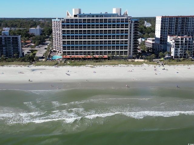 bird's eye view with a beach view and a water view