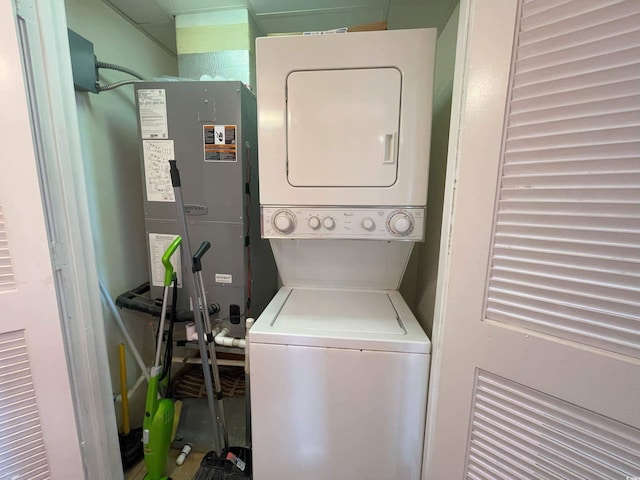 laundry room featuring stacked washer and clothes dryer