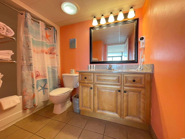 full bathroom featuring toilet, tile patterned flooring, shower / bath combo with shower curtain, and vanity