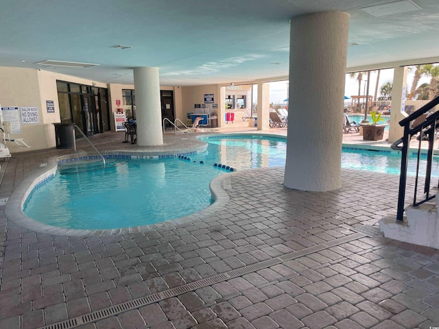 view of swimming pool with a patio